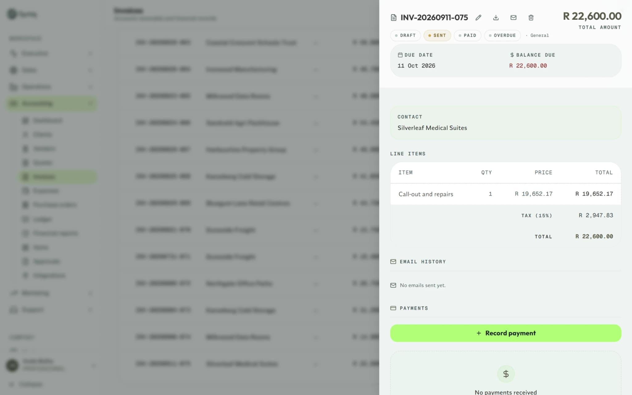 An unpaid invoice open in Syniq Accounting, with its line items, VAT and balance due.